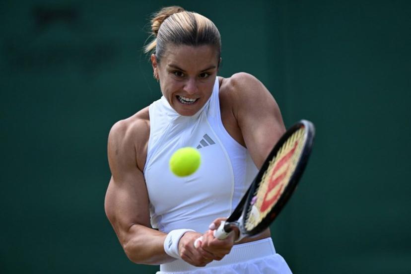 Greece's Maria Sakkari returns against Italy's Jasmine Paolini during their women's singles third round tennis match on the sixth day of the 2026 Wimbledon Championships at The All England Lawn Tennis and Croquet Club in Wimbledon, southwest London, on July 4, 2026.  Kirill KUDRYAVTSEV / AFP