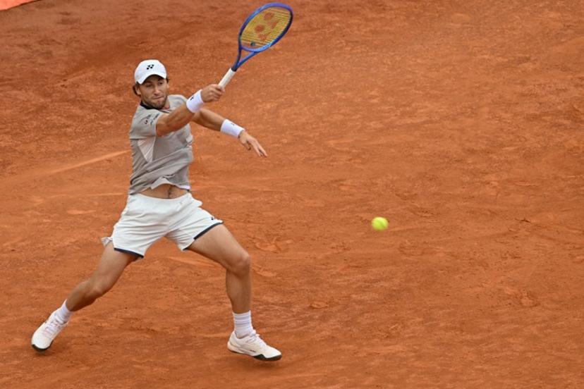 Norway's Casper Ruud hits a return to Italy's Luciano Darderi during their semi-final of the ATP Rome Open tennis tournament at Foro Italico in Rome on May 15, 2026.   Tiziana FABI / AFP