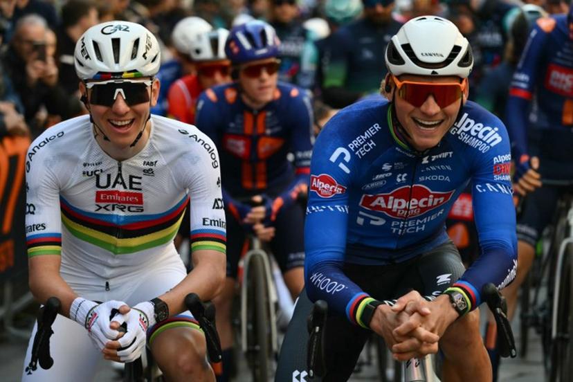 UAE Team Emirate's Slovenian rider Tadej Pogacar and Alpecin-Deceuninck's Dutch rider Mathieu van der Poel pose at the start of the Milan - Sanremo one-day classic cycling race, in Pavia, on March 21, 2026.  Marco BERTORELLO / AFP