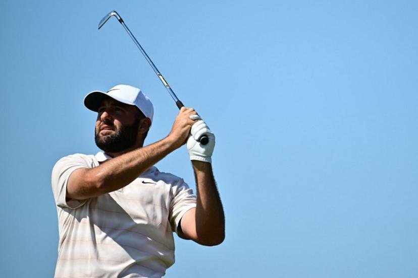 US golfer Scottie Scheffler watches his iron shot from the 12th tee on day four of the 154th Open Golf championship at Royal Birkdale Golf Club near Southport in north-west England on July 19, 2026.  Ben STANSALL / AFP
