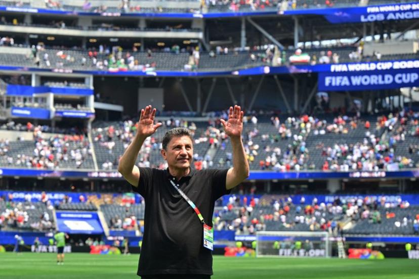 Iran's head coach Amir Ghalenoei celebrates at the end of the 2026 World Cup Group G football match between Belgium and Iran at the Los Angeles Stadium in Inglewood on June 21, 2026.   Frederic J. Brown / AFP