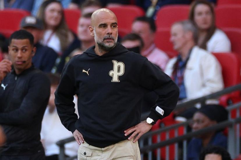 Manchester City's Spanish manager Pep Guardiola looks on during the English FA Cup semi final football match between Manchester City and Southampton at Wembley stadium in London, on April 25, 2026.  Adrian Dennis / AFP