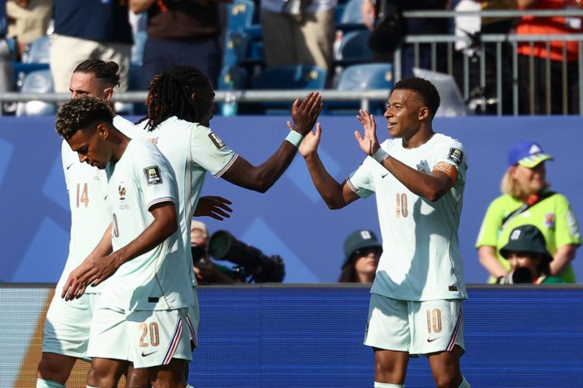 France's forward #10 Kylian Mbappe (R) celebrates scoring his team's first goal during the 2026 World Cup football tournament quarter-final match between France and Morocco at Boston Stadium in Foxborough on July 9, 2026.   CHARLY TRIBALLEAU / AFP