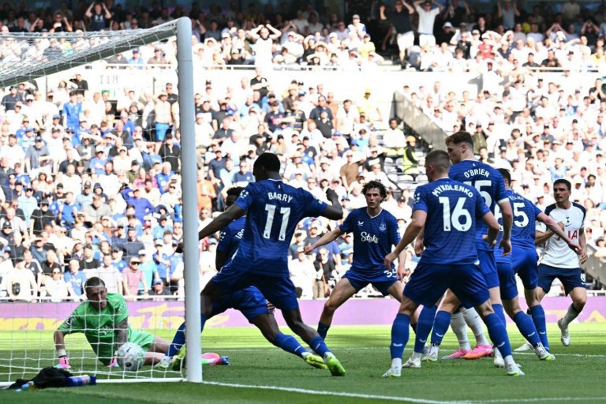 Tottenham Hotspur's Portugese midfielder #06 Joao Palhinha (R) sees his shot cross the West Ham goal-line for the opening goal of the English Premier League football match between Tottenham Hotspur and Everton at the Tottenham Hotspur Stadium in London, on May 24, 2026.  Ben STANSALL / AFP