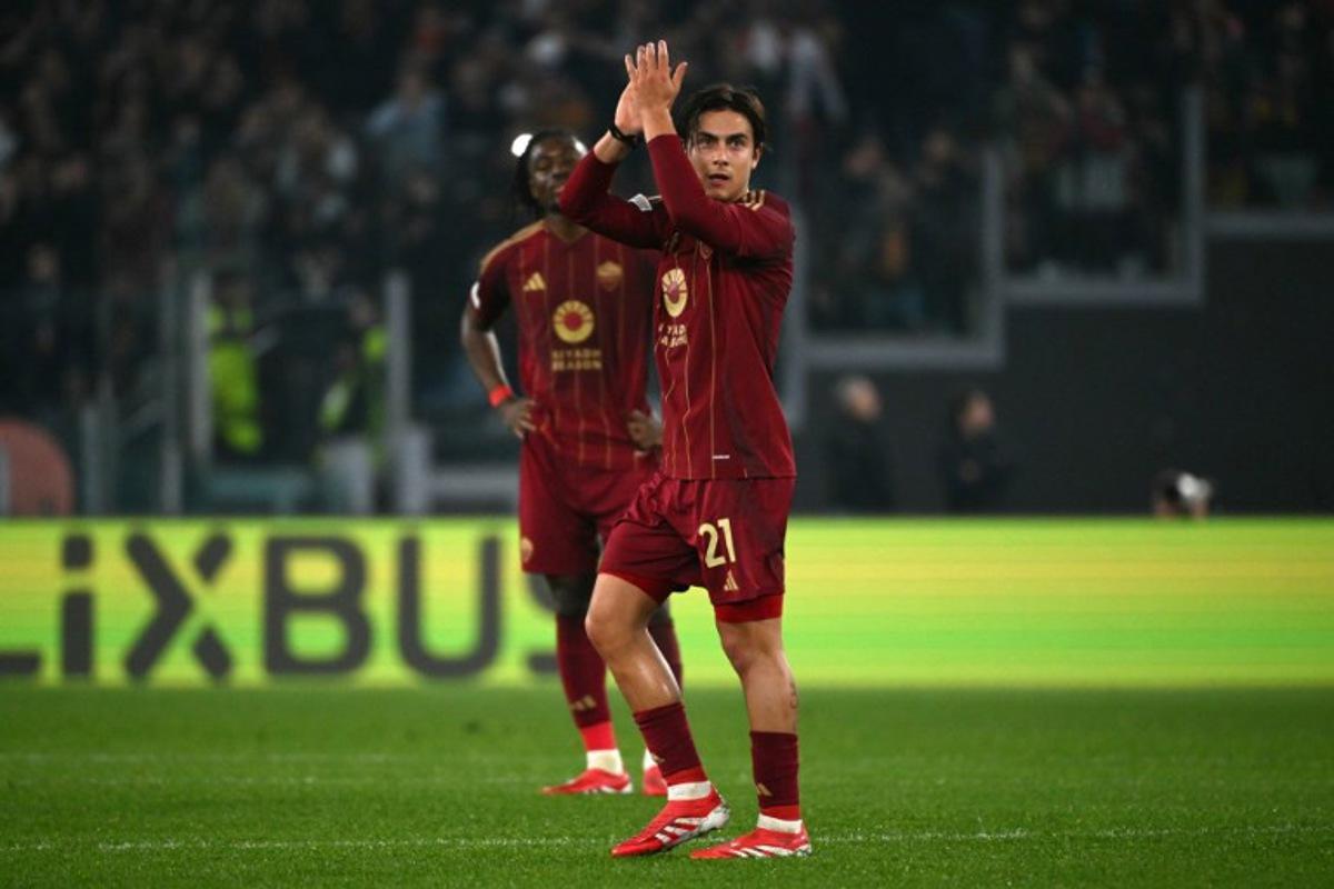 Roma's Argentine forward #21 Paulo Dybala leaves the pitch during the UEFA Europa League knockout round play-off 2nd leg football match between AS Roma and FC Porto at the Olympic stadium in Rome, on February 20, 2025.  Alberto PIZZOLI / AFP