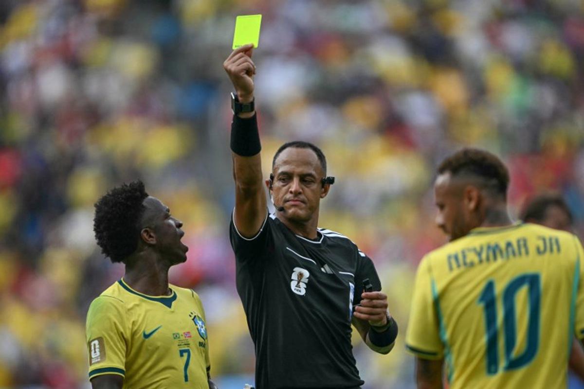US referee Ismail Elfath shows a yellow card to Brazil's forward #10 Neymar (out of frame) during the 2026 World Cup round of 16 football match between Brazil and Norway at the New York/New Jersey Stadium in East Rutherford on July 5, 2026.   MAURO PIMENTEL / AFP