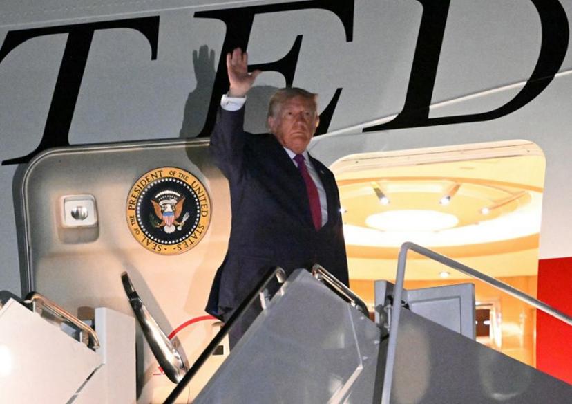 US President Donald Trump waves as he boards Air Force One at Ellsworth Air Force Base, South Dakota on July 3, 2026. Trump delivered remarks during the Independence Day events at Mount Rushmore National Memorial in Keystone, South Dakota. Mandel NGAN / AFP