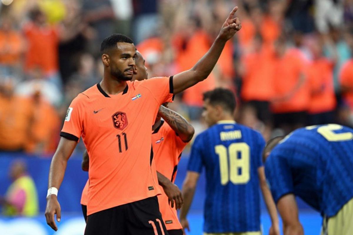 Netherlands' forward #11 Cody Gakpo celebrates scoring his team's fourth goal during the 2026 World Cup Group F football match between the Netherlands and Sweden at the Houston Stadium in Houston on June 20, 2026.   RONALDO SCHEMIDT / AFP