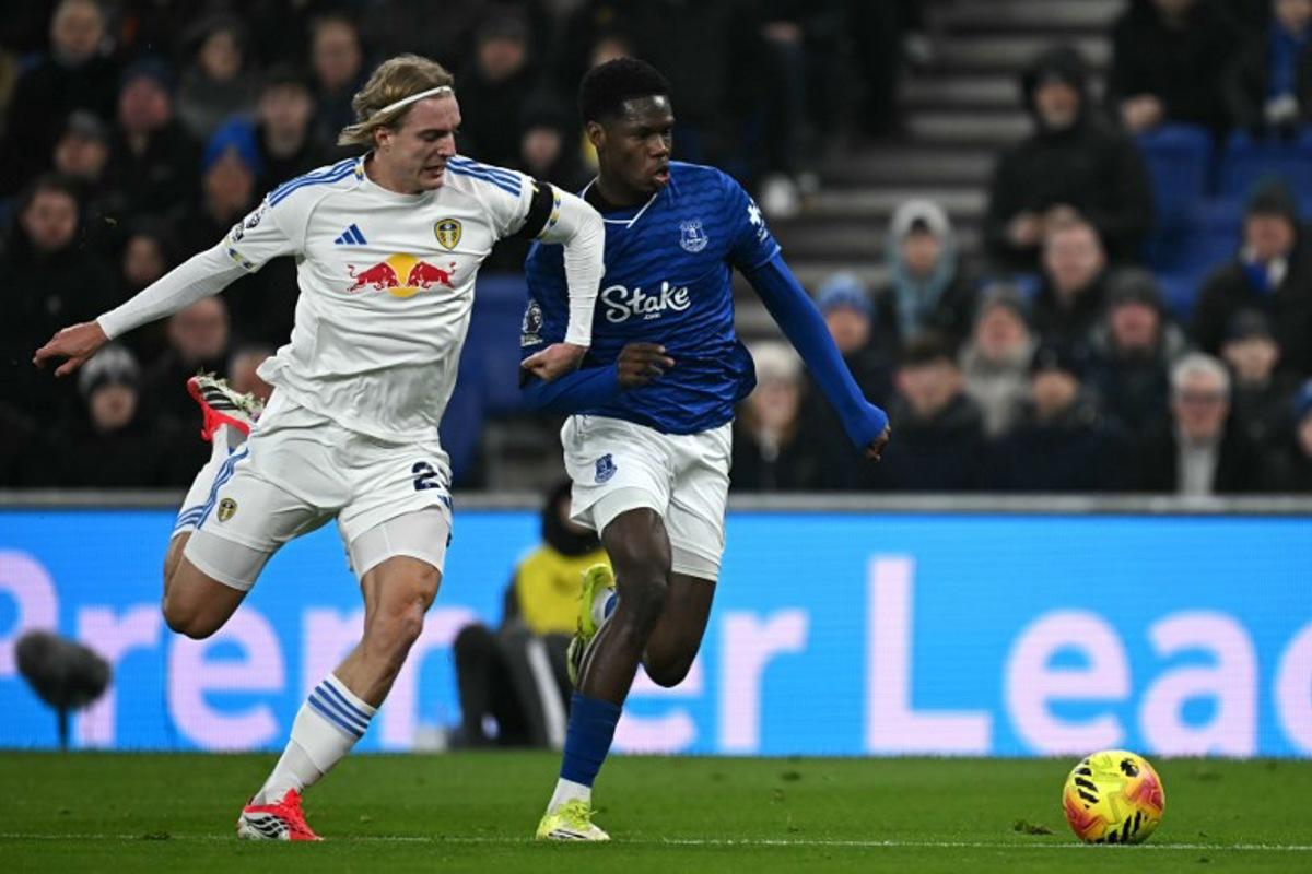 Leeds United's Belgian defender #23 Sebastiaan Bornauw (L) vies with Everton's French striker #11 Thierno Barry (R) during the English Premier League football match between Everton and Leeds United at Hill Dickinson Stadium in Liverpool, north west England on January 26, 2026.  Paul ELLIS / AFP