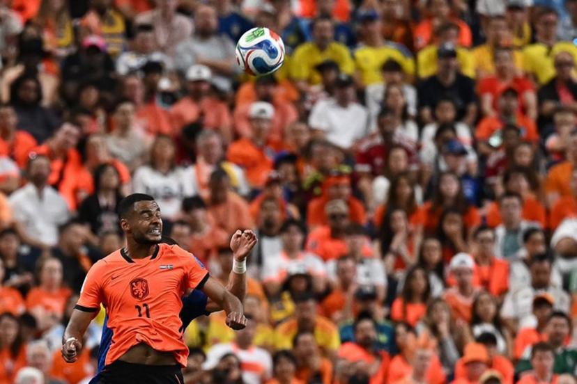 Netherlands' forward #11 Cody Gakpo jumps for the ball   during the 2026 World Cup Group F football match between the Netherlands and Sweden at the Houston Stadium in Houston on June 20, 2026.   Paul ELLIS / AFP
