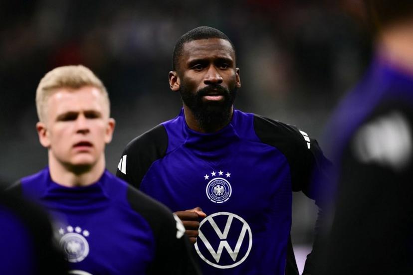Germany's defender #02 Antonio Rudiger warms up ahead of the Nations League quarter final first leg football match between Italy and Germany at the San Siro Stadium in Milan, on March 20, 2025.  Marco BERTORELLO / AFP