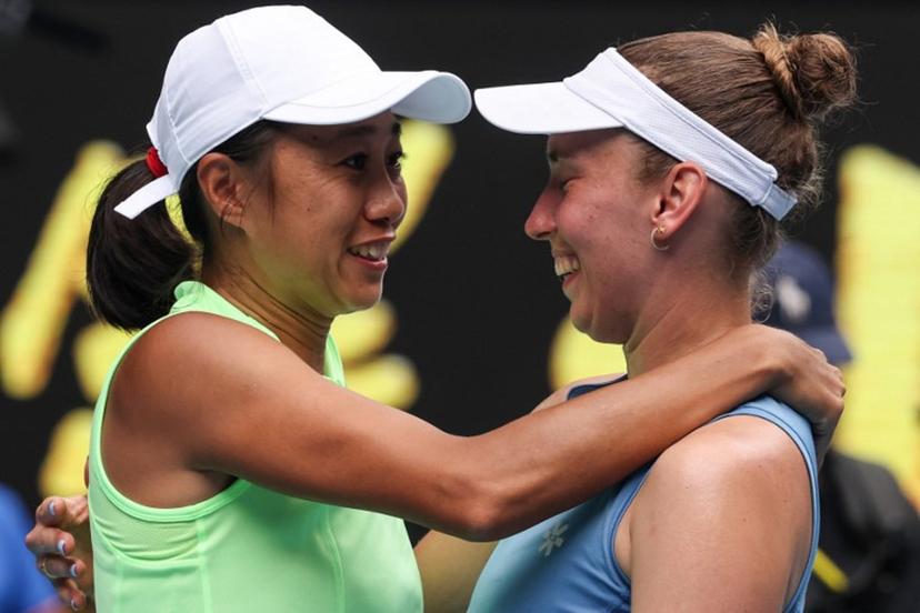 China's Zhang Shuai (L) celebrates with partner Belgium's Elise Mertens after their victory in their women's doubles final match against Kazakhstan's Anna Danilina and Serbia's Aleksandra Krunic on day fourteen of the Australian Open tennis tournament in Melbourne on January 31, 2026.  DAVID GRAY / AFP
