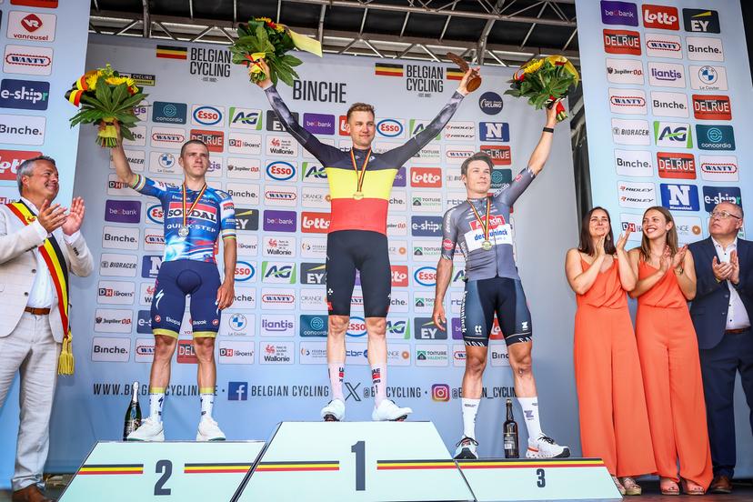 Belgian Remco Evenepoel of Soudal Quick-Step, Belgian Tim Wellens of UAE Team Emirates and Belgian Jasper Philipsen of Alpecin-Deceuninck pictured on the podium after the men's elite road race of the Belgian Cycling Championships, 230km from and to the Grand Place square in Binche on Sunday 29 June 2025. BELGA PHOTO DAVID PINTENS