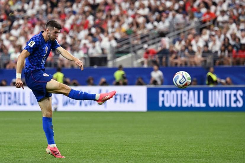 Croatia's midfielder #17 Petar Sucic kicks the ball during the 2026 World Cup Group L football match between England and Croatia at the Dallas Stadium in Arlington on June 17, 2026.   Paul ELLIS / AFP