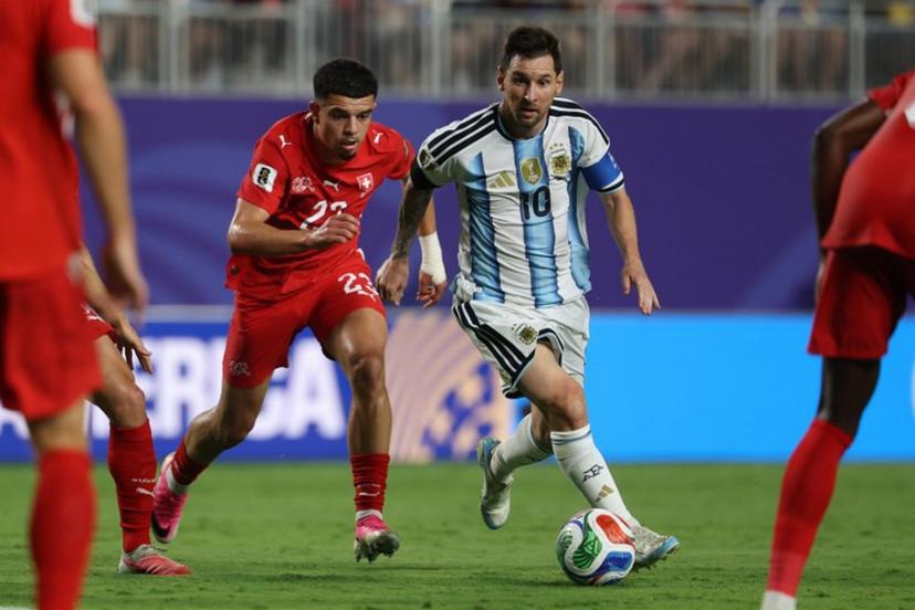 Argentina's forward #10 Lionel Messi runs with the ball followed by Switzerland's forward #23 Zeki Amdouni during the 2026 World Cup football tournament quarter-final match between Argentina and Switzerland at the Kansas City Stadium in Kansas City on July 11, 2026.   Odd ANDERSEN / AFP