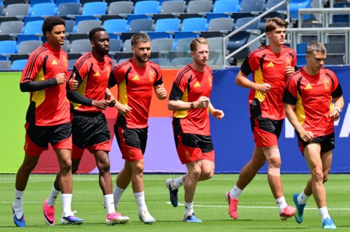 (From L) Belgium's defender #16 Koni de Winter, forward #14 Dodi Lukebakio, midfielder #23 Nicolas Raskin, midfielder #07 Kevin De Bruyne, forward #17 Charles De Ketelaere and forward #10 Leandro Trossard take part in a training session at Carson Sports Park in California on June 20, 2026, on the eve of their 2026 World Cup Group G match against Iran.  Frederic J. BROWN / AFP