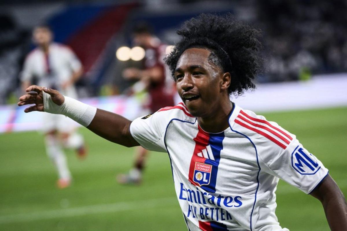 Lyon's Belgian forward #11 Malick Fofana (C) celebrates after scoring a goal during the French L1 football match between Olympique Lyonnais (OL) and FC Metz at the Groupama Stadium in Decines-Charpieu, central-eastern France on August 23, 2025.  ARNAUD FINISTRE / AFP