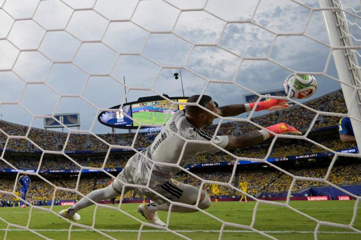 Curacao's goalkeeper #01 Eloy Room makes a save during the 2026 World Cup Group E football match between Ecuador and Curacao at the Kansas City Stadium in Kansas City on June 20, 2026.   JUAN MABROMATA / AFP