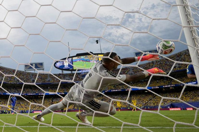 Curacao's goalkeeper #01 Eloy Room makes a save during the 2026 World Cup Group E football match between Ecuador and Curacao at the Kansas City Stadium in Kansas City on June 20, 2026.   JUAN MABROMATA / AFP