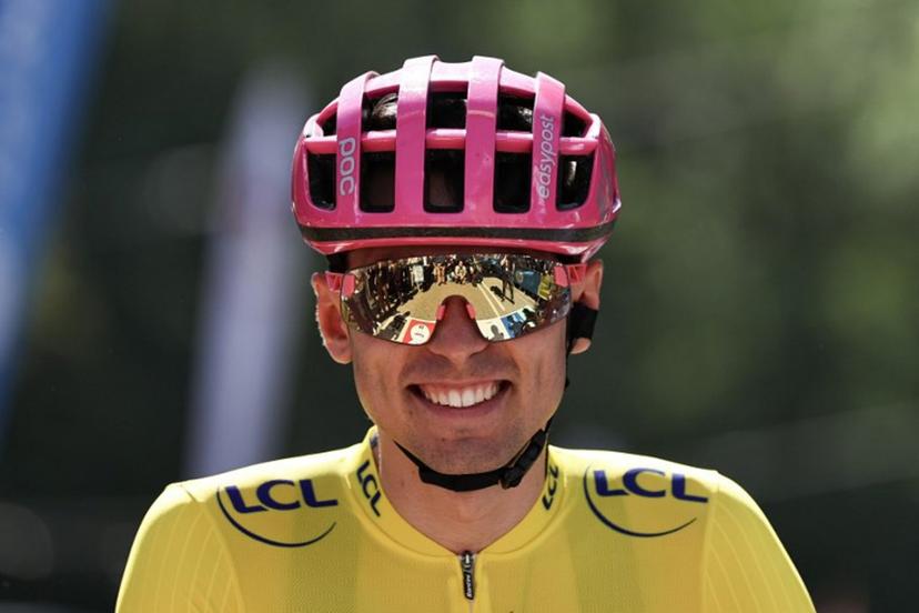 EF Education - EasyPost's French rider Alex Baudin wearing the overall leader's yellow jersey awaits the start of the 2nd stage of the Tour Auvergne-Rhone-Alpes cycling race (formerly known as the Criterium du Dauphine), 234,3km between Saint-Martin-Le-Vinoux and Le Puy-en-Velay, in the French Alps, on June 8, 2026.  Anne-Christine POUJOULAT / AFP