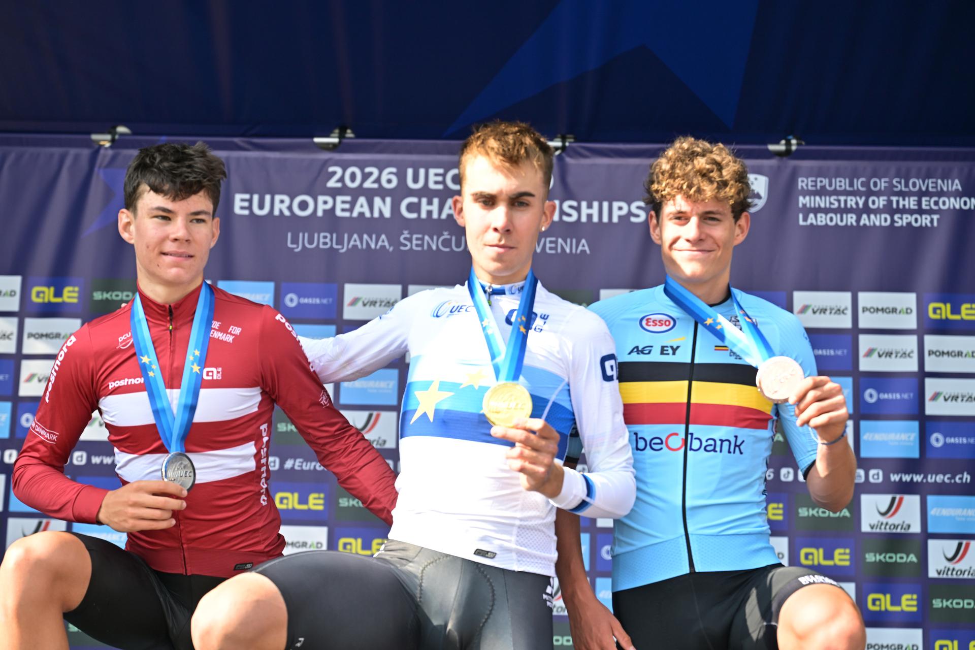 Denmark's Malthe Risbjerg; Spain's Benjamin Noval Suarez and Belgium's Vic De Smet celebrate on the podium of the Men Junior Individual Time Trial race (22km) at the cycling UEC Road European Championships, in Ljubljana, Slovenia, on Wednesday 7 October 2026. The UEC Road European Championships are taking place from 02 to 07 October in Ljubljana, Slovenia. BELGA PHOTO DAVID PINTENS