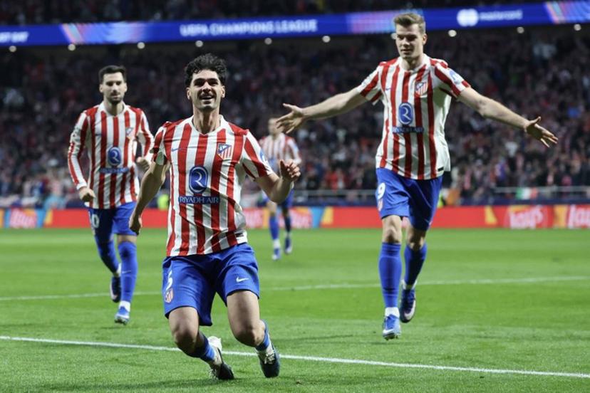 Atletico Madrid's US midfielder #05 Johnny Cardoso (C) celebrates scoring his team's second goal during the UEFA Champions League knockout round play-off second leg football match between Club Atletico de Madrid and Club Brugge KV at Metropolitano Stadium in Madrid on February 24, 2026.  Pierre-Philippe MARCOU / AFP