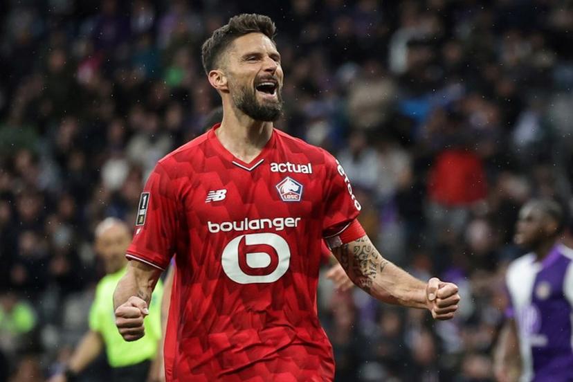 Lille's French forward #09 Olivier Giroud celebrates after scoring during the French L1 football match between Toulouse FC and Lille LOSC at the TFC Stadium in Toulouse, southwestern France, on April 12, 2026.  Valentine CHAPUIS / AFP