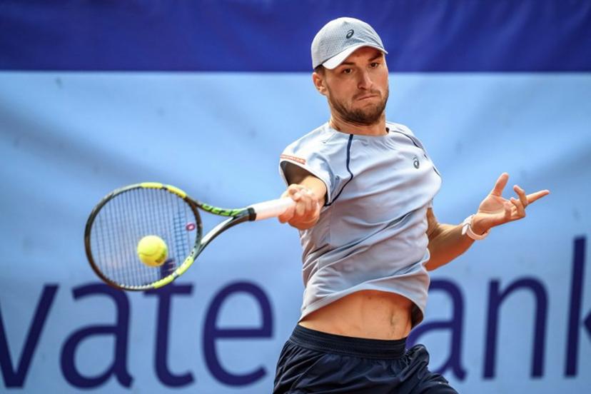 Belgium's Raphael Collignon returns the ball to Greece's Stefanos Tsitsipas during their men's singles final match at the Swiss Open tennis tournament in Gstaad, on July 19, 2026.  Fabrice COFFRINI / AFP