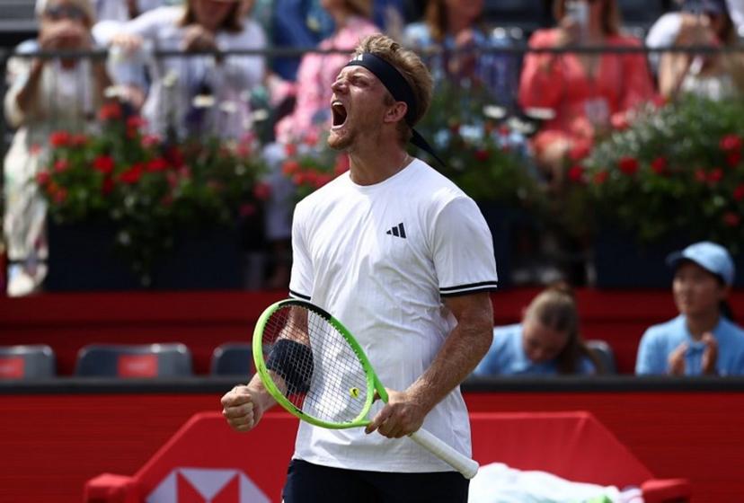 Spain's Alejandro Davidovich Fokina celebrates winning against  France's Corentin Moutet in their men's singles round of 16 tennis match on day three of the ATP HSBC Championships at Queen's Club in west London on June 18, 2026. Fokina won the match 6-4, 6-3. Henry NICHOLLS / AFP