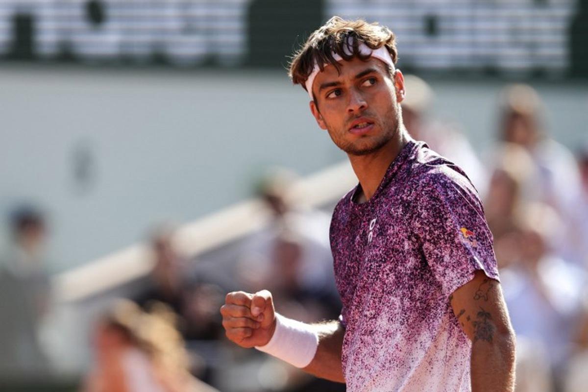 Italy's Flavio Cobolli reacts after a point as he plays against during his men's final singles match against Germany's Alexander Zverev on day 15 of the French Open tennis tournament on Court Philippe-Chatrier at the Roland-Garros Complex in Paris on June 7, 2026.  Dimitar DILKOFF / AFP