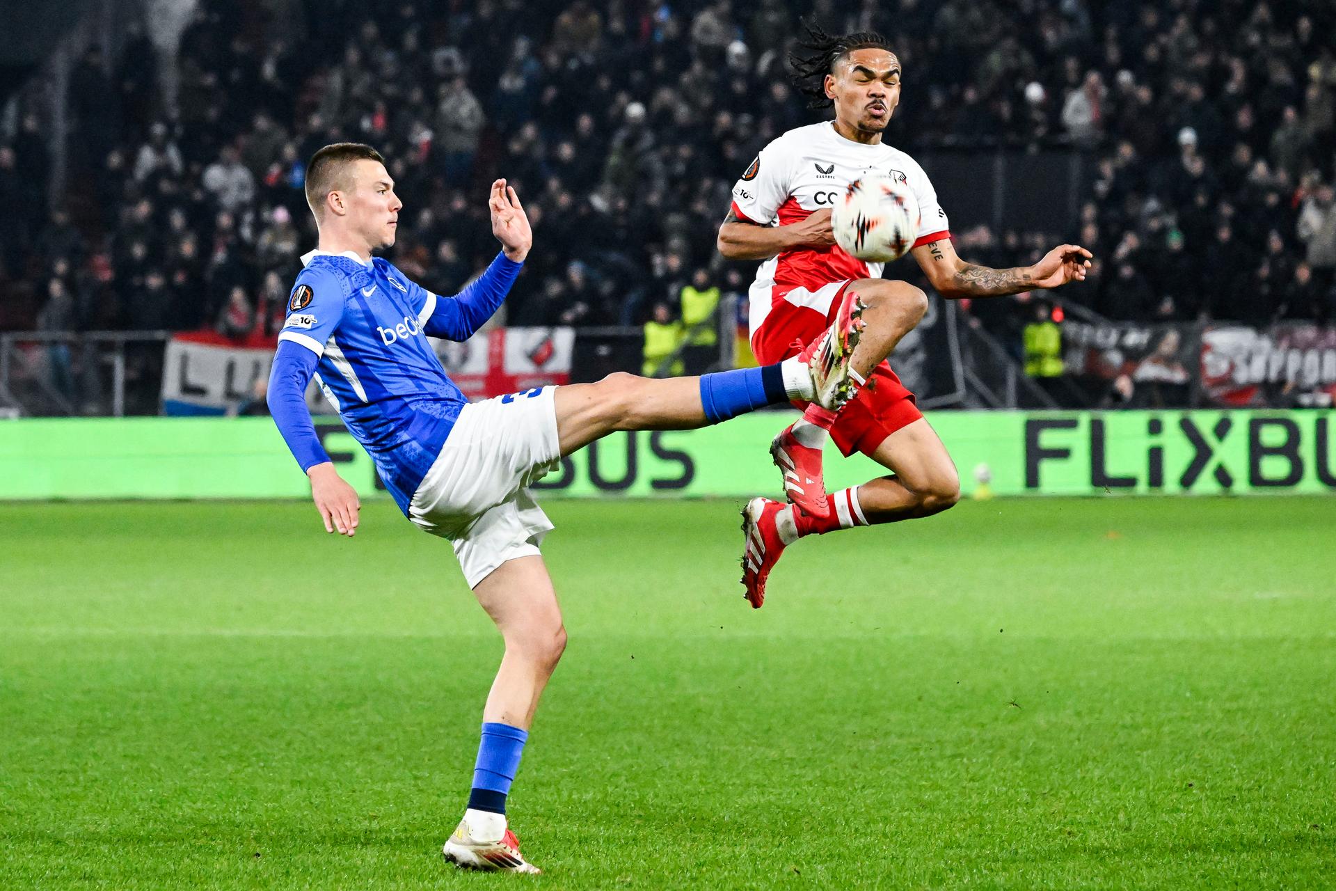 Genk's Daan Heymans and Utrecht's Alonzo Engwanda pictured in action during a soccer game between Dutch soccer club FC Utrecht and Belgian KRC Genk, on Thursday 22 January 2026 in Utrecht, Netherlands, the seventh game (out of 8) in the league phase of the UEFA Europa League competition. BELGA PHOTO TOM GOYVAERTS