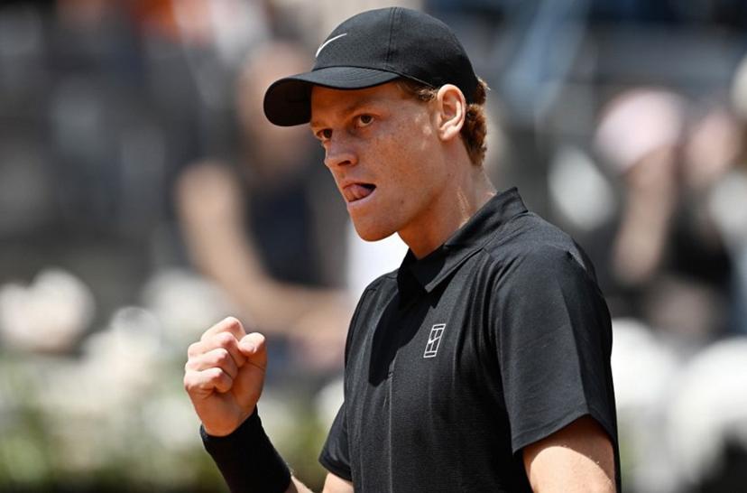 Italy's Jannik Sinner celebrates a point against Russia's Andrey Rublev during the ATP Rome Open tennis tournament at Foro Italico in Rome on May 14, 2026.   Tiziana FABI / AFP