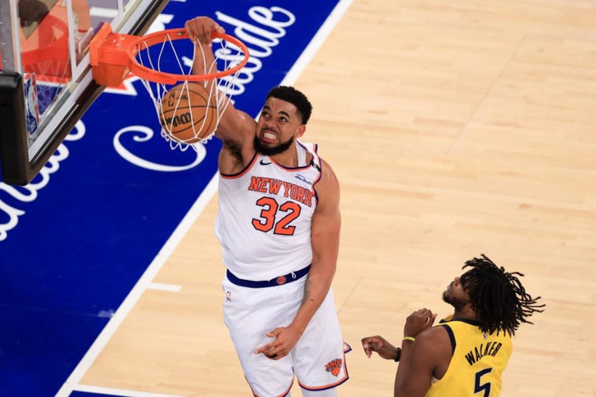 Knicks' center #32 Karl-Anthony Towns reacts after a dunk during Game Five of the Eastern Conference Finals of the 2025 NBA Playoffs between the New York Knicks and the Indiana Pacers at Madison Square Garden in New York on May 29, 2025.  CHARLY TRIBALLEAU / AFP