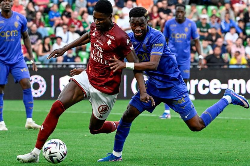 Metz's Malian midfielder #08 Boubacar Traore (L) fights for the ball with Monaco's Ivorian forward #24 Simon Adingra during the French L1 football match between FC Metz and AS Monaco at the Stade Saint-Symphorien in Longeville-les-Metz, eastern France on May 2, 2026.  Jean-Christophe VERHAEGEN / AFP