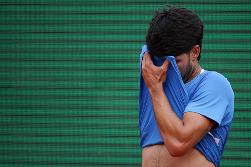 Spain's Carlos Alcaraz reacts as he plays against Italy's Jannik Sinner during the Monte Carlo ATP Masters Series Tournament final tennis match on Court Rainier III at the Monte-Carlo Country Club in Roquebrune-Cap-Martin, south-eastern France on April 12, 2026.  Valery HACHE / AFP
