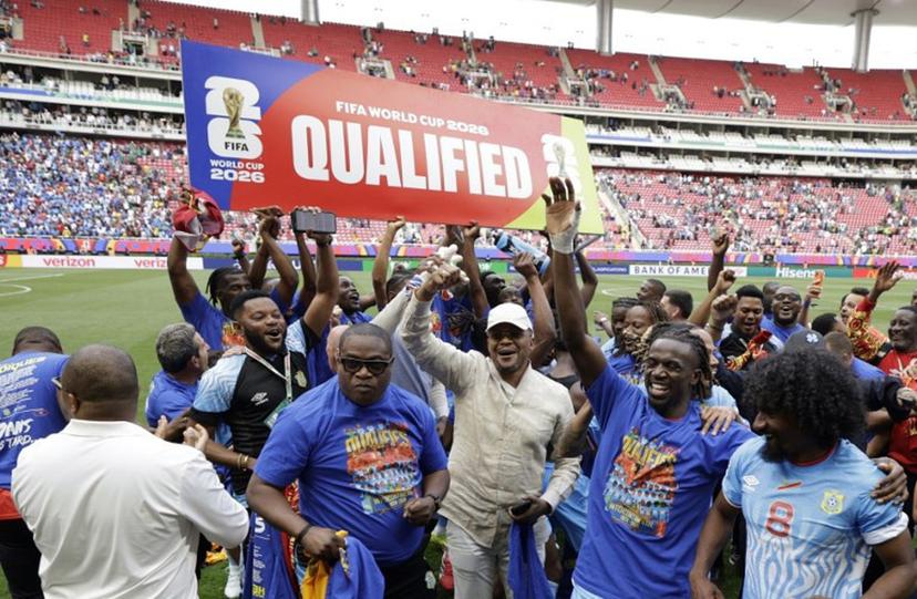 DR Congo players and coaching staff celebrate after winning the match and qualifying for the World Cup during the 2026 FIFA World Cup qualifiers final playoff football match between the Democratic Republic of the Congo and Jamaica at the Akron Stadium in Zapopan, Jalisco state, Mexico, on March 31, 2026.  Ulises Ruiz / AFP