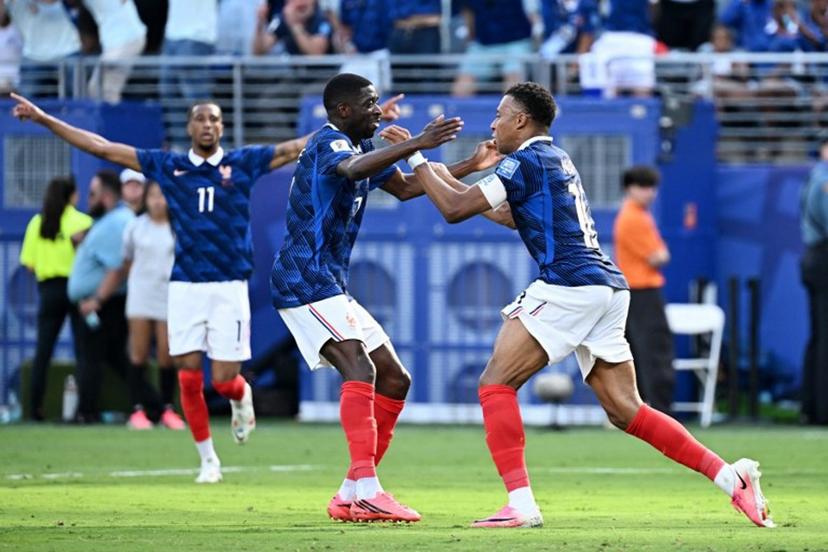 France's forward #10 Kylian Mbappe (R) celebrates scoring his team's first goal with forward #07 Ousmane Dembele during the 2026 World Cup round of 32 football match between France and Sweden at the New York/New Jersey Stadium in East Rutherford on June 30, 2026.   Jewel SAMAD / AFP
