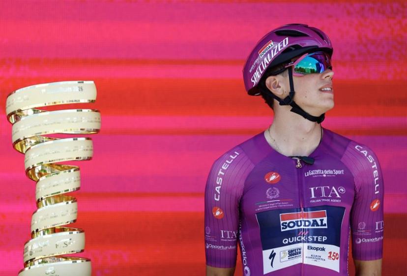 Soudal Quick-Step French rider Paul Magnier wearing the points classification mauve jersey (Maglia Ciclamino) looks on during the presentation of the teams prior the 3nd stage of the Giro d'Italia 2026 - Tour of Italy cycling race between Plovdiv and Sofia, Bulgaria, on May 10, 2026.  Luca Bettini / AFP