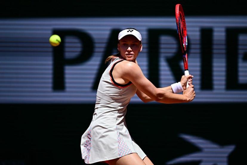 Kazakhstan's Elena Rybakina plays a backhand return to Slovenia's Veronika Erjavec during their women's singles match on day 2 of the French Open tennis tournament on Court Philippe-Chatrier at the Roland-Garros Complex in Paris on May 25, 2026.  JULIEN DE ROSA / AFP