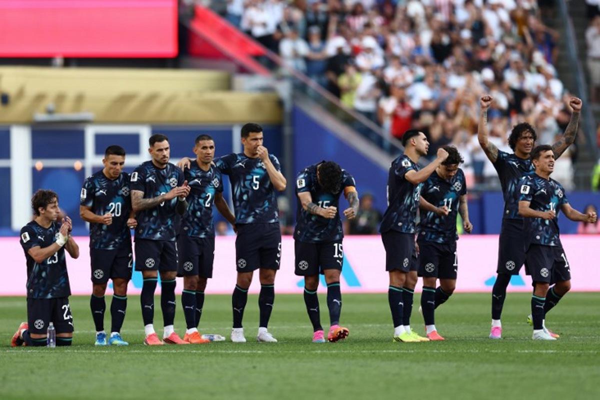 Paraguay's players celebrate during the penalty shootout of the 2026 World Cup round of 32 football match between Germany and Paraguay at the Boston Stadium in Foxborough on June 29, 2026.   CHARLY TRIBALLEAU / AFP