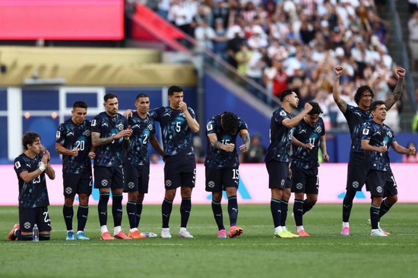 Paraguay's players celebrate during the penalty shootout of the 2026 World Cup round of 32 football match between Germany and Paraguay at the Boston Stadium in Foxborough on June 29, 2026.   CHARLY TRIBALLEAU / AFP