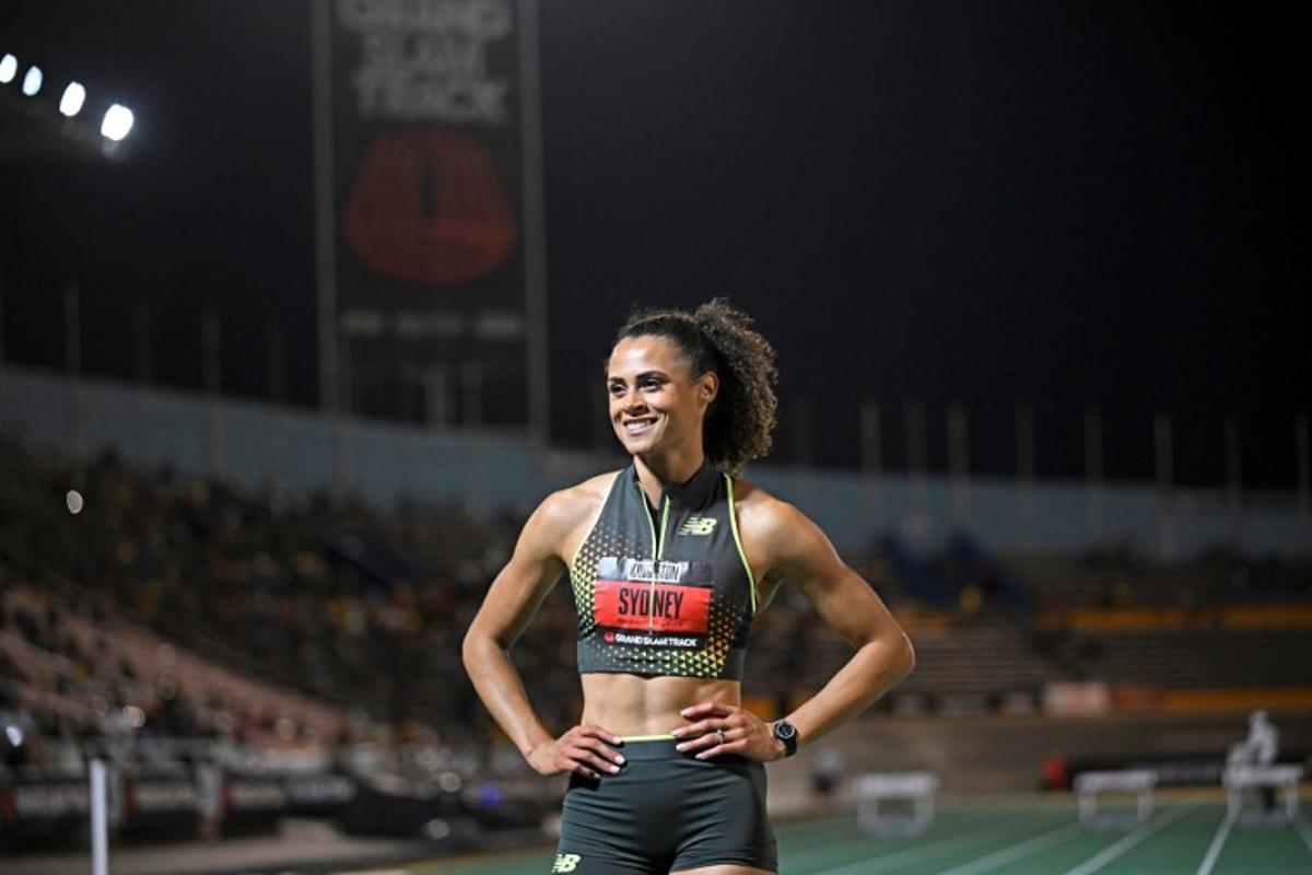 USA's Sydney McLaughlin-Levrone of team New Balance celebrates winning the women's 400 meter long hurdles during the Grand Slam Track competition at the National Stadium in Kingston, Jamaica on April 4, 2025.  Ricardo Makyn / AFP