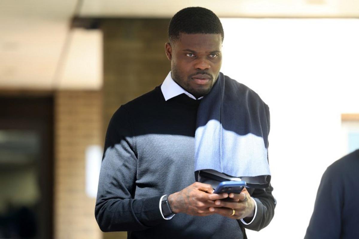 Former Arsenal midfielder Thomas Partey departs following his hearing at the Southwark Crown Court in London on April 13, 2026. Partey, who now plays for Spanish club Villarreal, was charged in February with two further counts of rape. Toby Shepheard / AFP