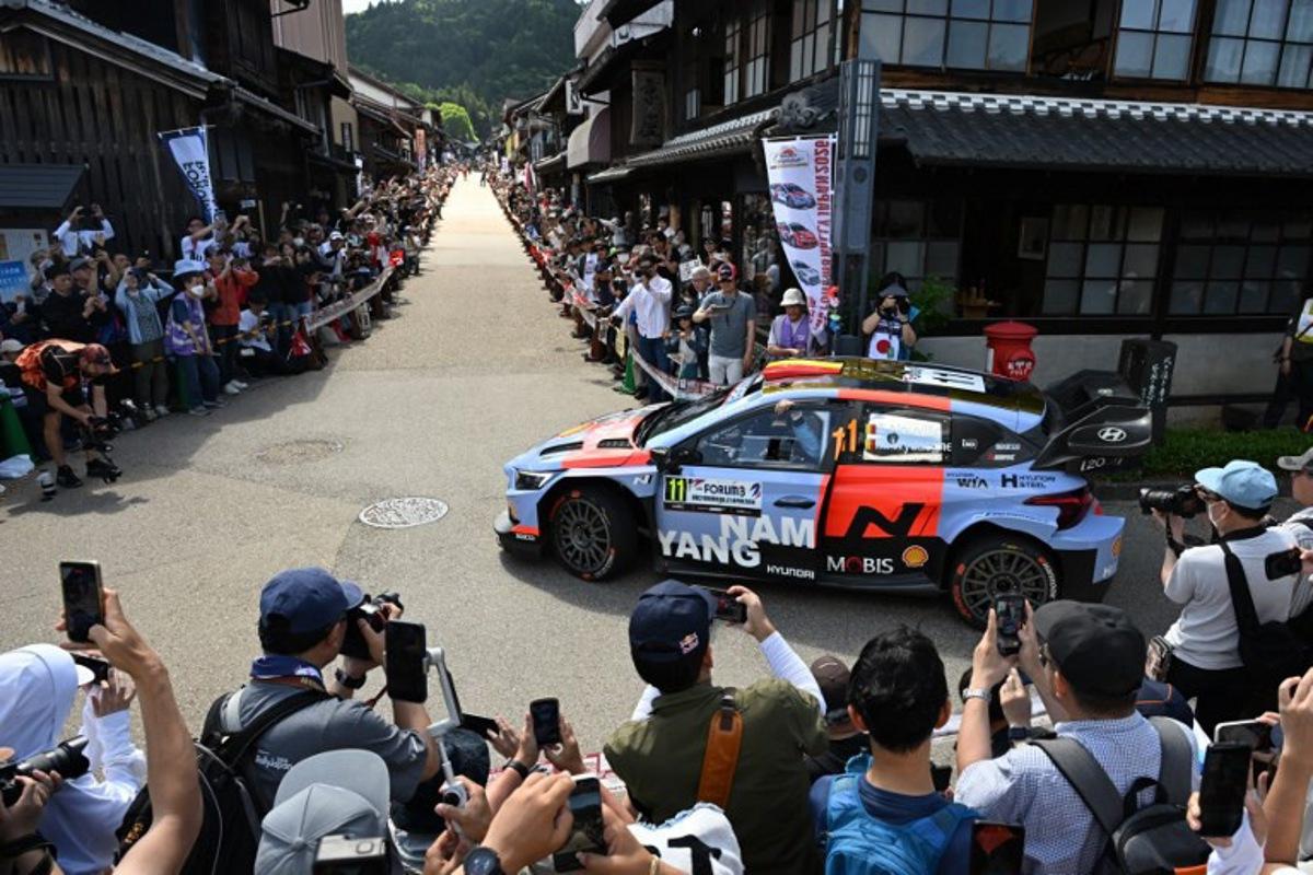 Thierry Neuville of Belgium and his co-driver Martijn Wydaeghe of Belgium drive their Hyundai i20 N Rally1 on the traditional Japanese townscape of Iwamura during the Rally Japan, the 7th round of the FIA World Rally Championships in Ena city, Gifu prefecture on May 30, 2026.   Toshifumi KITAMURA / AFP