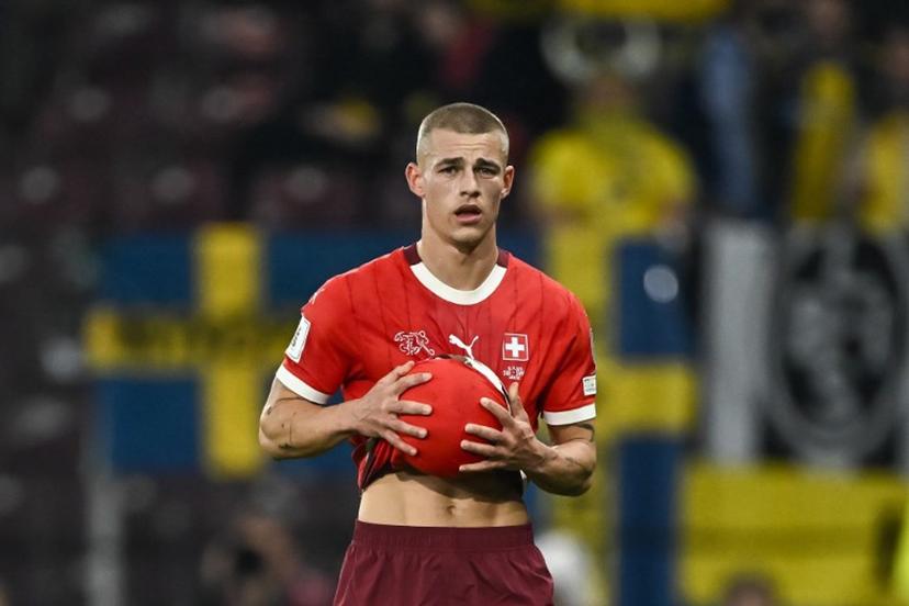 Switzerland's defender #2 Miro Muheim holds the ball during the FIFA World Cup 2026 Group B European qualification football match between Switzerland and Sweden at the Geneva stadium, in Geneva, on November 15, 2025.  Fabrice COFFRINI / AFP