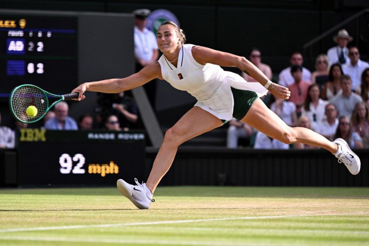 Belarus's Aryna Sabalenka returns to Japan's Naomi Osaka during their women's singles round of 16 tennis match on the seventh day of the 2026 Wimbledon Championships at The All England Lawn Tennis and Croquet Club in Wimbledon, southwest London, on July 5, 2026.  Kirill KUDRYAVTSEV / AFP