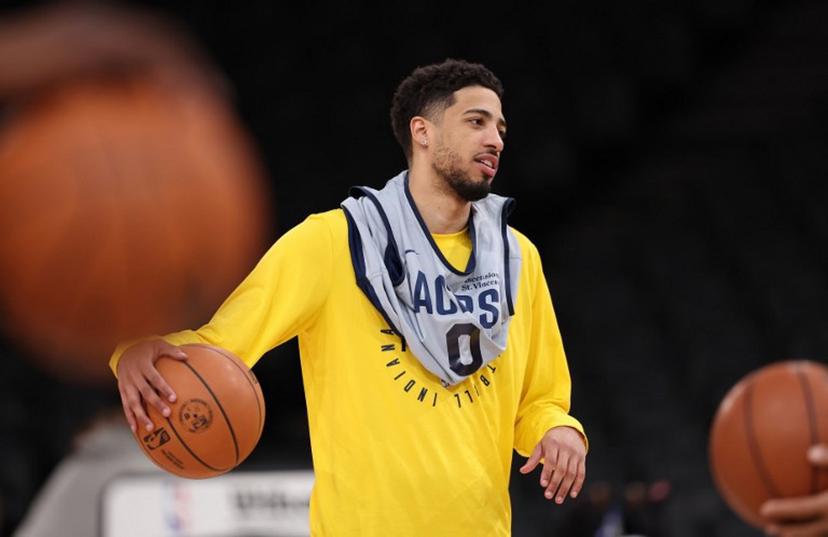 Indiana Pacers' US guard #0 Tyrese Haliburton holds the ball as he attends a training session at the Accor Arena - Palais Omnisports de Paris-Bercy - in Paris on January 22, 2025.  San Antonio Spurs will face the Indiana Pacers on January 23 and 25 at Bercy, two NBA games relocated to Paris.  FRANCK FIFE / AFP