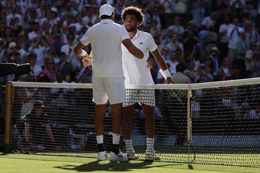 Italy's Matteo Berrettini is congratulated by France's Arthur Fils for winning their men's singles second round tennis match on the fourth day of the 2026 Wimbledon Championships at The All England Lawn Tennis and Croquet Club in Wimbledon, southwest London, on July 2, 2026.  Adrian Dennis / AFP