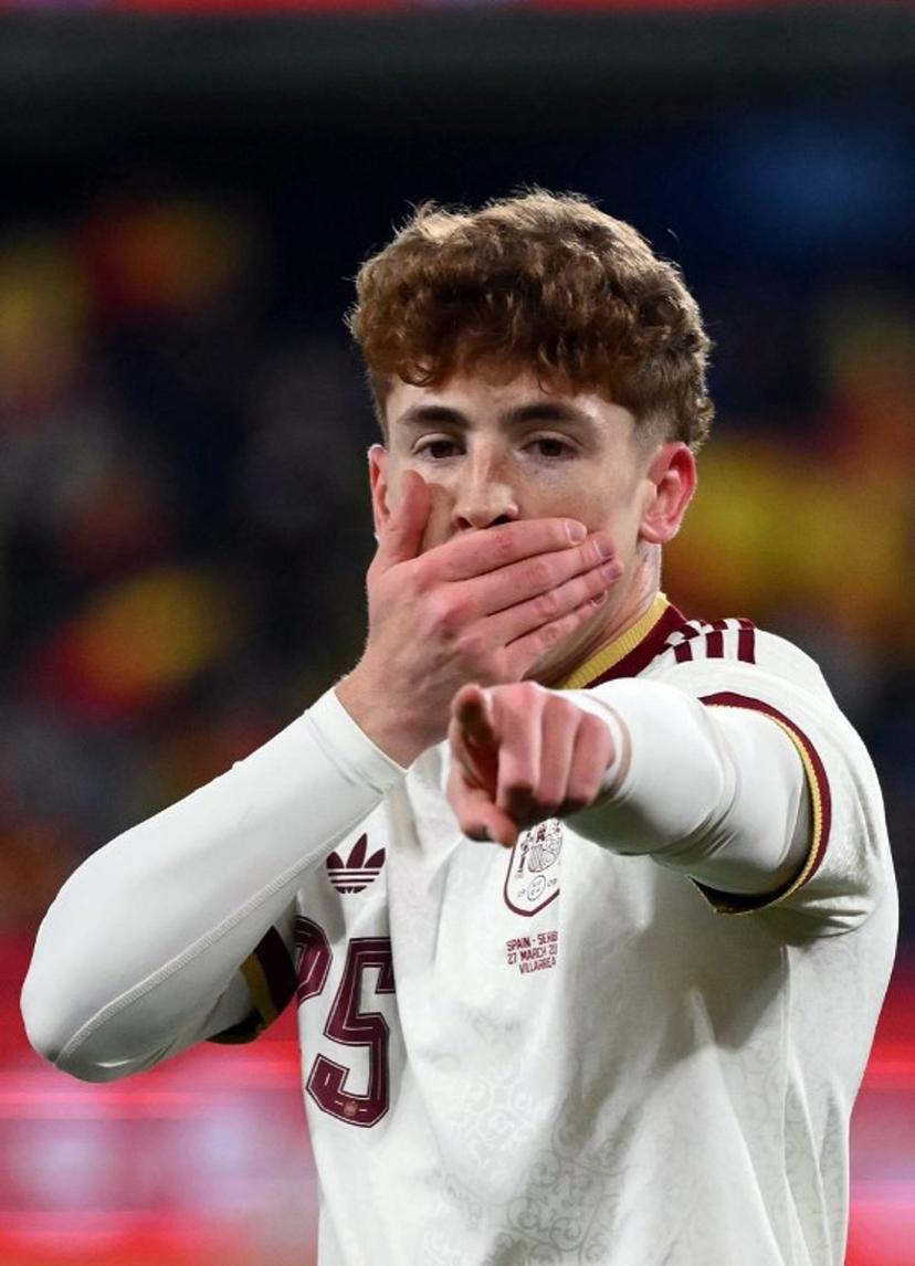 Spain's forward #25 Victor Munoz Villanueva celebrates scoring his team's third goal during the international friendly football match between Spain and Serbia at La Ceramica Stadium in Vila-real on March 27, 2026.  JOSE JORDAN / AFP
