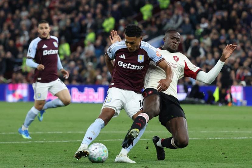 Aston Villa's English striker #11 Ollie Watkins (C) shoots past Liverpool's French defender #05 Ibrahima Konate (R) to score their second goal during the English Premier League football match between Aston Villa and Liverpool at Villa Park in Birmingham, central England on May 15, 2026.  Darren Staples / AFP